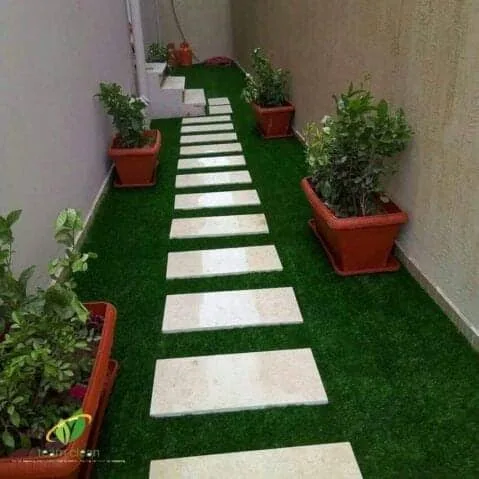 تنسيق حدائق تركيب العشب الصناعي تركيب الشلال زراعه التيل الطبيعي